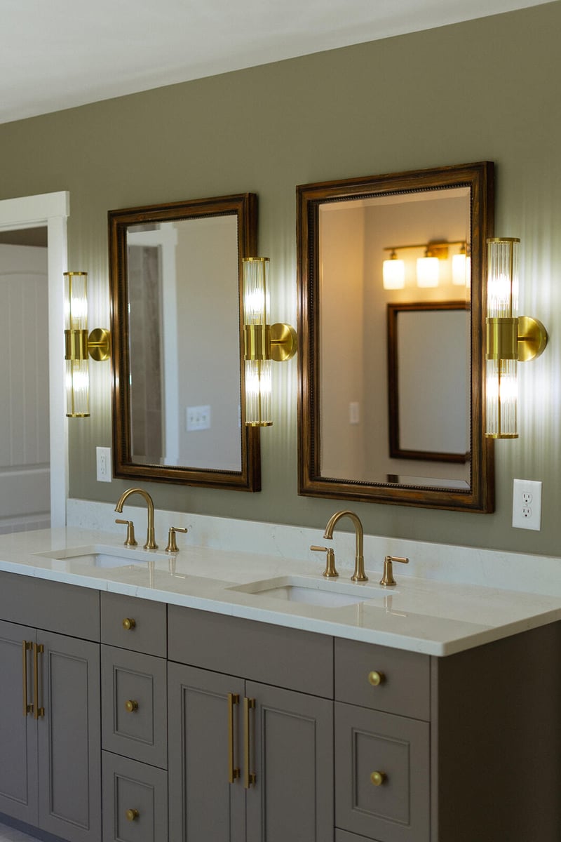 Bathroom with gray cabinets and gold finishes