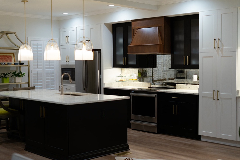Kitchen with black cabinets and white countertops