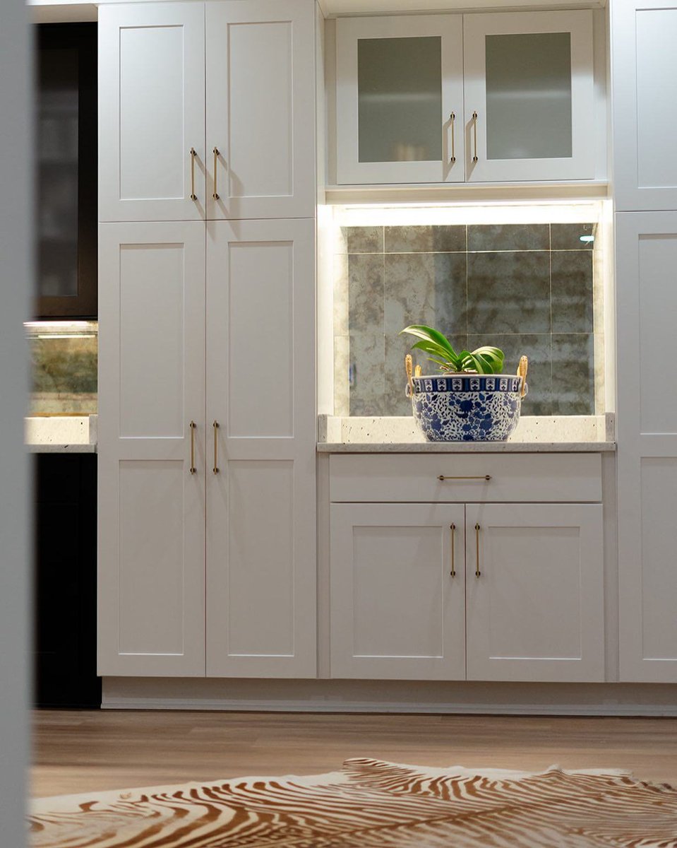 White kitchen cabinets with gold hardware